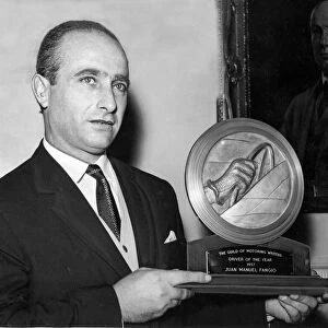 Juan Manuel Fangio received the Driver of the Year trophy from the Guild of Motoring