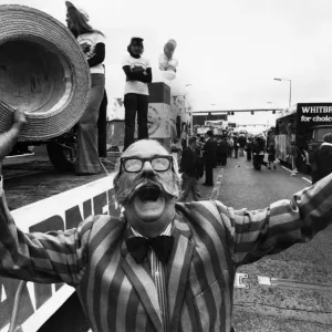 Jubilant Ray Tonken throws up a jubilant cheer as his Tom garner float moves off in