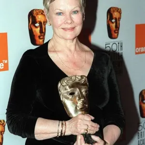Judi Dench April 1998 pictured holding BAFTA Award