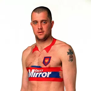 Julian Dicks of West Ham has a Daily Mirror football kit painted on to his body during