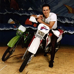 Julian McMahon, Australian actor, sits on motorbike