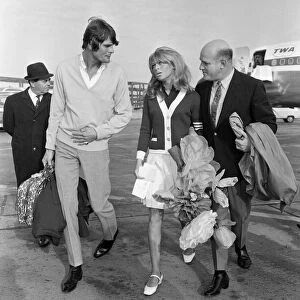 Julie Christie and boyfriend Don Bessant arriving at London Airport after she was awarded