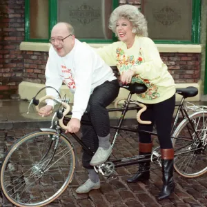 Julie Goodyear and Roy Barraclough pictured on a tandem bike on the set of Coronation Julie Goodyear and Roy Barraclough pictured on a tandem bike on the set of Coronation