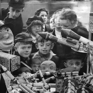 A jumble of small faces peer at a pile of very big bangers A jumble of small faces peer at a pile of very big bangers