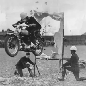 The jump through the paper hoop one of the many solo motorcycle tricks shown at Catterick
