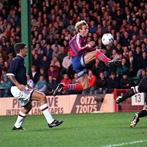 Jurgen Klinsmann scores for Bayern Munich against Raith Roversat during a UEFA Cup mnatch