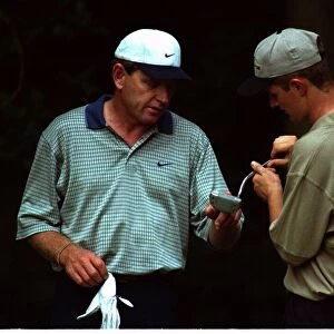 Justin Rose July 1998 under the watchful eye of his hero Nick Price as they