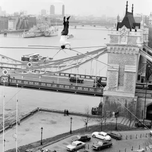 Karl Wallenda, Tightrope Walker, crosses 100ft above the ground, near Tower Bridge