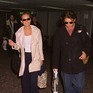 Kate Moss Model arrives at Heathrow Airport with her boyfriend Johnny Depp Actor
