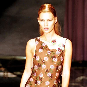 Kate Moss models one of the dresses from the first ever collection designed by Donatella