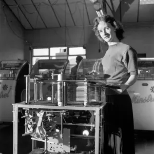 Kathleen Craig juke box queen who selects records for jukeboxes. 1956 A516-003