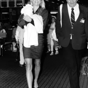 Kathy Emberg with daughter of Rod Stewart Ruby walking through Heathrow airport Kathy Emberg with daughter of Rod Stewart Ruby walking through Heathrow airport