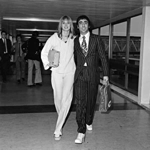 Keith Moon, drummer of The Who rock group, pictured arriving at Heathrow Airport from Los