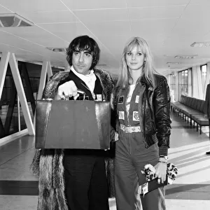 Keith Moon, drummer of The Who rock group, pictured leaving Heathrow Airport for holiday