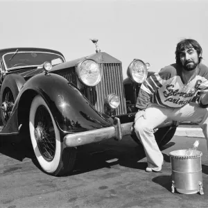 Keith Moon, drummer of The Who rock group, with his 1929 built Rolls Royce car in Keith Moon, drummer of The Who rock group, with his 1929 built Rolls Royce car in