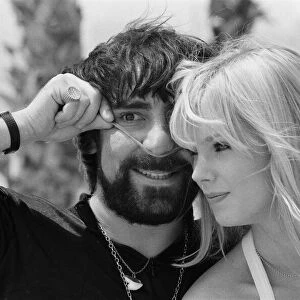 Keith Moon, drummer of The Who rock group with model Annette Lax in the resort of Malibu