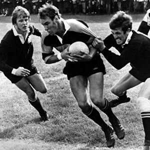 Keith Poole, of Newport RFC, trying to break the grip of rival flanker Wilson Lauder of