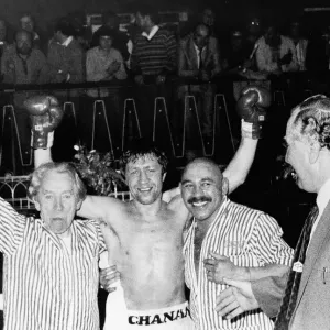 Ken Buchanan celebrates winning match with his arms in the air