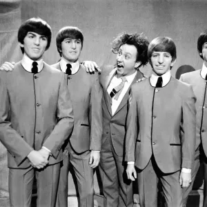 Ken Dodd (centre) posing with Madame Tussauds figures of The Beatles Ken Dodd (centre) posing with Madame Tussauds figures of The Beatles