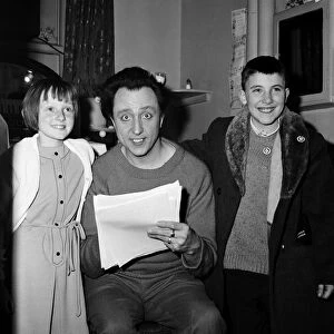 Ken Dodd in his dressing room at the Palladium with children. 13th December 1965