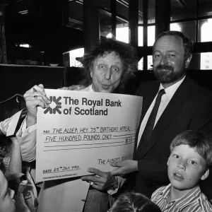 Ken Dodd joins forces with Jimbo the clown and the kids at the Albert Dock