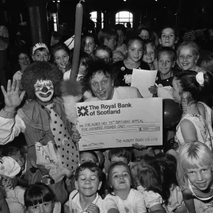 Ken Dodd joins forces with Jimbo the clown and the kids at the Albert Dock