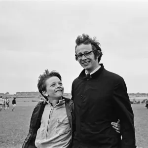 Print of Ken Loach on a school football field with David Bradley Print of Ken Loach on a school football field with David Bradley