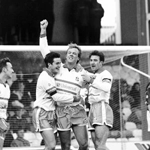 Kerry Dixon, football player for Luton, with arm in air after scoring a goal