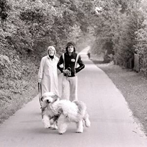 Kevin Keegan Football star with his wife in Germany. Old English sheep dogs
