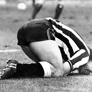 Kevin Keegan injured after crashing into the Grimsby keeper. Circa 1983