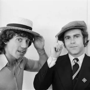 Kevin Keegan in a straw boater hat and Elton John in his own hat Kevin Keegan in a straw boater hat and Elton John in his own hat
