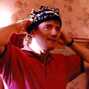 Kevin Keegan trying on a Newcatle United hat