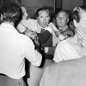 Kevin McClory, film producer, being restrained in bar room brawl with London film critic Kevin McClory, film producer, being restrained in bar room brawl with London film critic