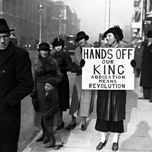 King Edward VIII Abdication Crisis December 1936. A woman holding a banner outside
