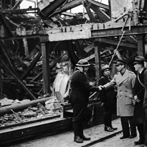 King George VI meets air raid wardens during his visit to the bomed damaged city of