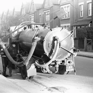 A Kingston Upon Thames council worker seen here cleansing the gullys and sewers A Kingston Upon Thames council worker seen here cleansing the gullys and sewers