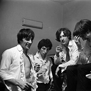 The Kinks pop group relaxing in their dressing room before a concert September1964