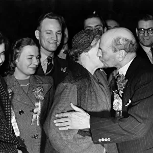 A kiss for Clement Attlee from his wife after his ardious election campaign