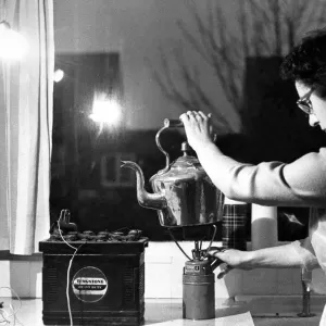 In the kitchen a spare car battery and a headlamp bulb give enough light to work in In the kitchen a spare car battery and a headlamp bulb give enough light to work in