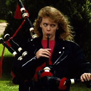 Kylie Minogue blowing into bagpipes September 1988