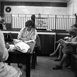 Four ladies studying the form guide before placing their bets at a Ladies only betting
