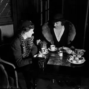 Two ladies taking afternoon tea. c. 1930 Two ladies taking afternoon tea. c. 1930