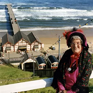 A lady poses by Saltburn Pier in Victorian clothing. 18th August 1991