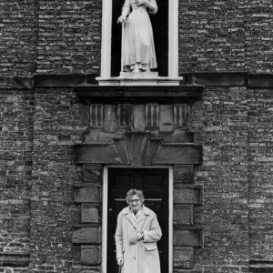 A lady stands outside Sir William Turners Almhouses, Kirkleatham. 14th February 1981 A lady stands outside Sir William Turners Almhouses, Kirkleatham. 14th February 1981