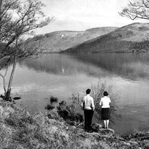 Lake District - A couple stand at the waters edge at Ullswater 19 March 1963