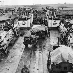 Landing craft being unloaded at the Rangoon (Yangdon) beach head. May 1945 Landing craft being unloaded at the Rangoon (Yangdon) beach head. May 1945