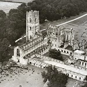 A large congregation gathers at Fountains Abbey near Ripon for an open air Sunday service
