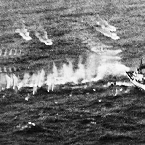 A large tanker was hit amid ships by a torpedo, , one minesweeper