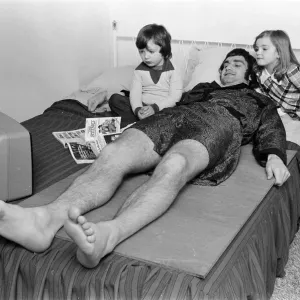Larry Lloyd Coventry City football player lying on bed at home as he recuperates Larry Lloyd Coventry City football player lying on bed at home as he recuperates