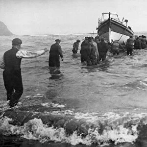 Launching the lifeboat at Robin Hoods Bay near Whitby in North Yorkshire to rescue